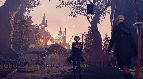 Gif of 2B and 9s walking into a theme park with balloons and fireworks going off.